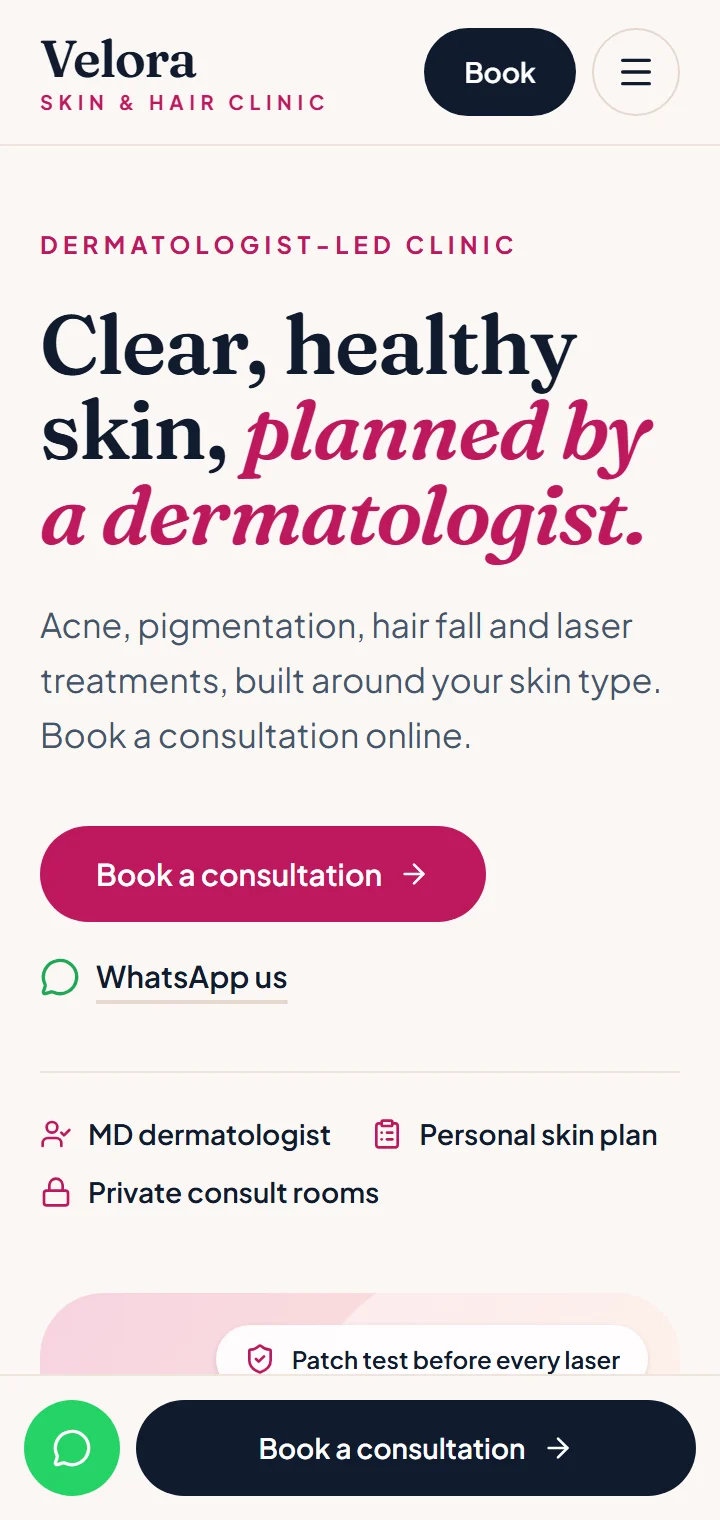 Skin clinic demo website on a phone